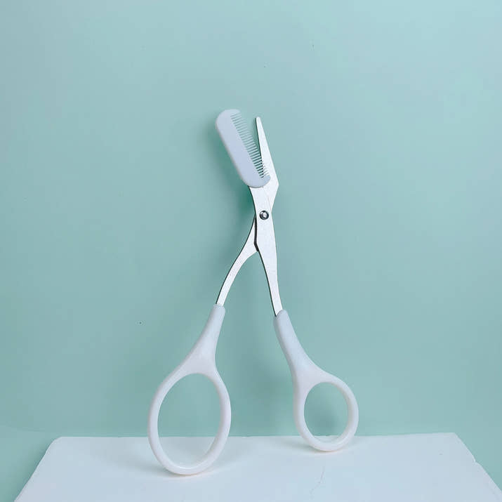 Pink eyebrow trimming scissors with built-in comb - stainless steel, precise grooming tool, creating perfect eyebrows